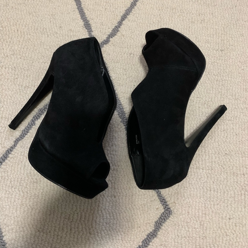Black suede high heels.